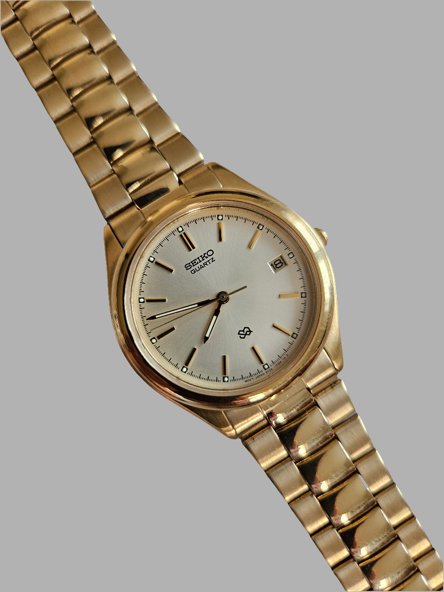 Seiko S2 Quartz Mens gold tone watch.