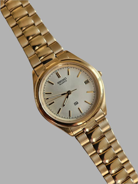 Seiko S2 Quartz Mens gold tone watch.